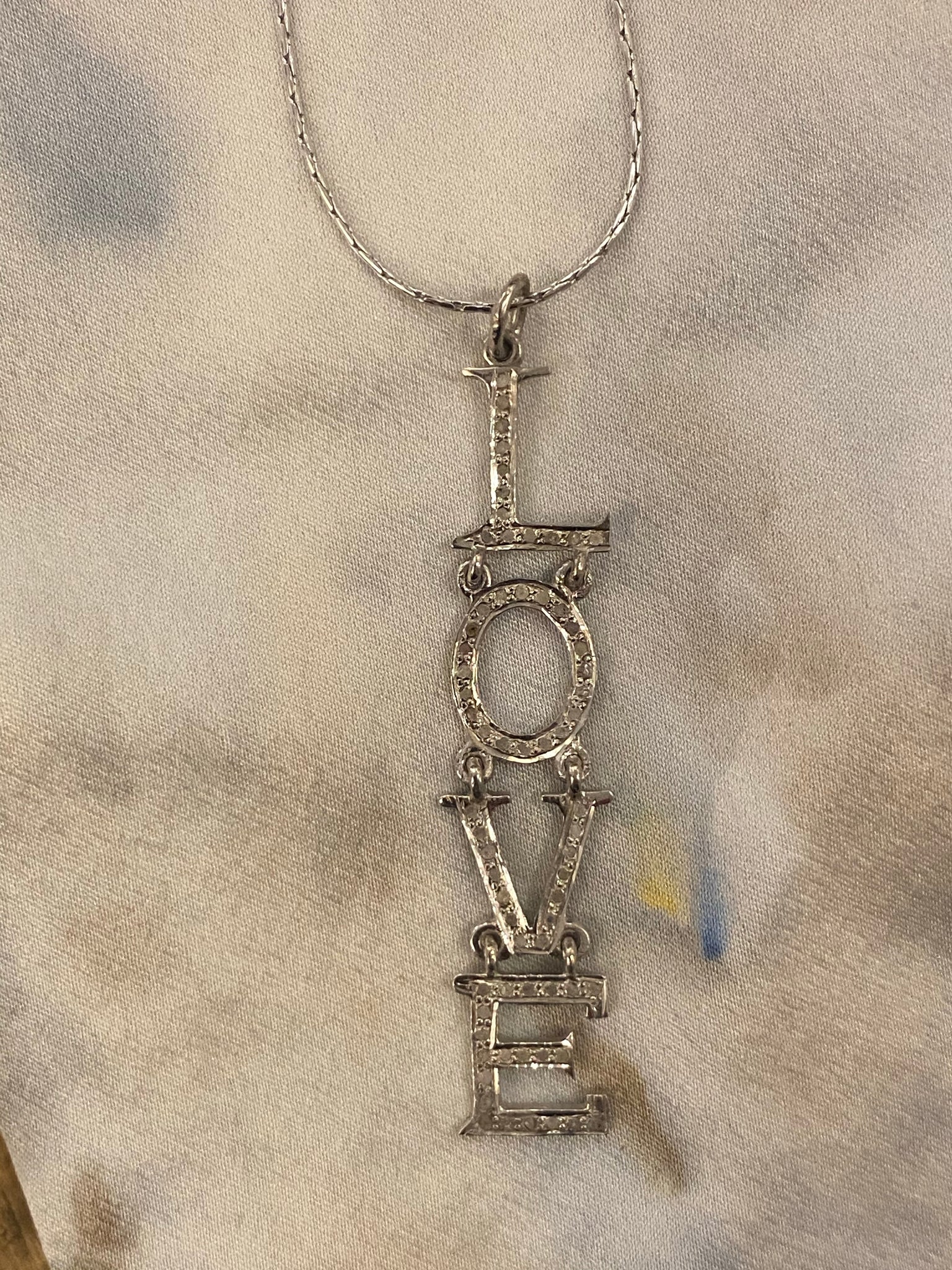 Pave love necklace
