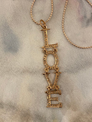 Pave love necklace
